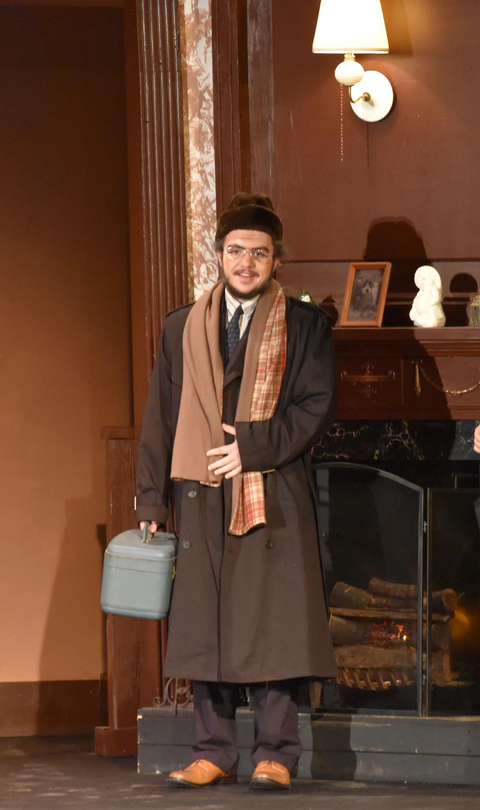 Alex Matthes performing on a stage in a theatrical production